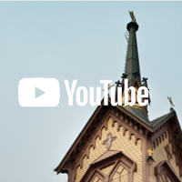 Lapinlahden kirkon torni ja YouTuben logo.